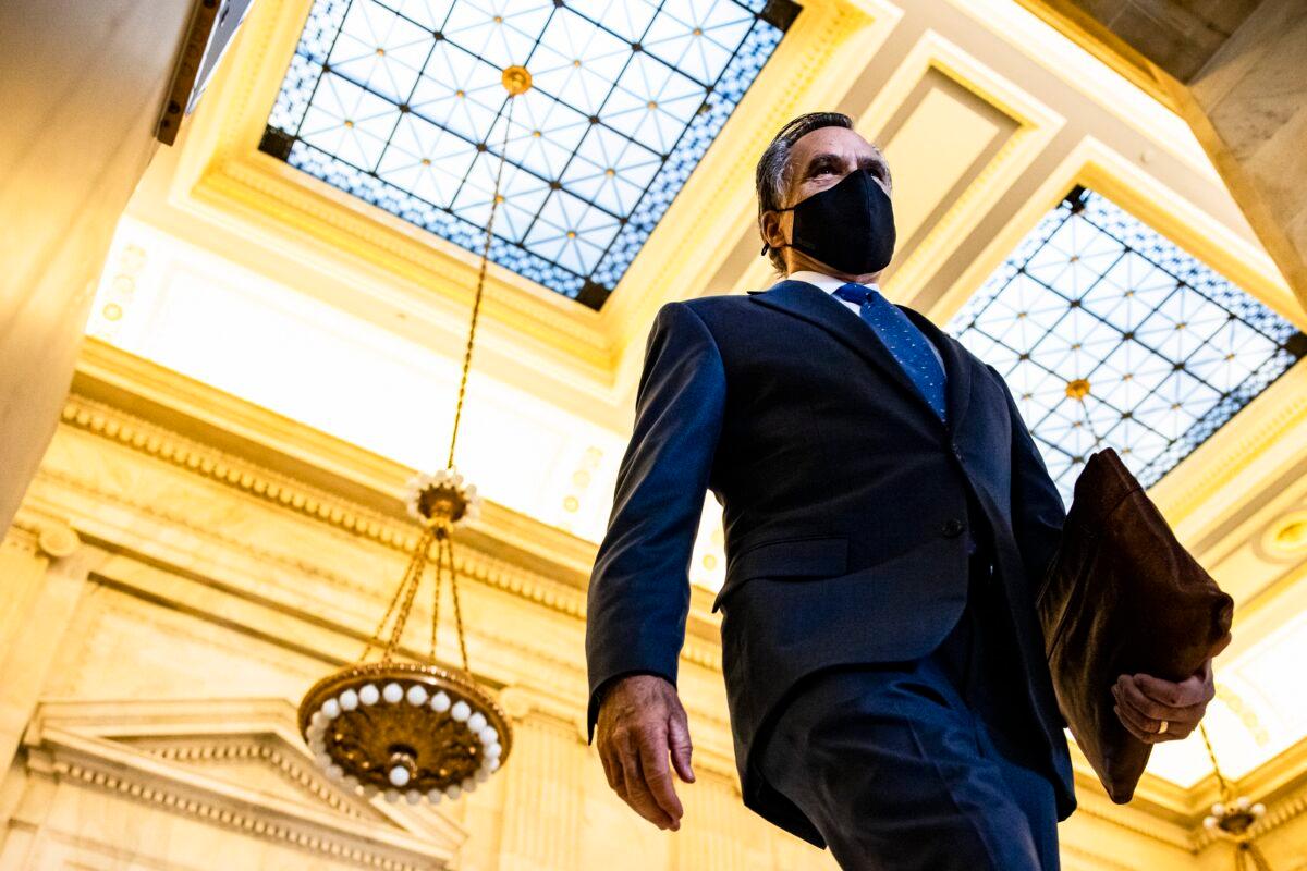 Sen. Mitt Romney (R-Utah) leaves the Senate GOP policy luncheon in the Rayburn Senate Office Building in Washington on March 2, 2021. (Samuel Corum/Getty Images)
