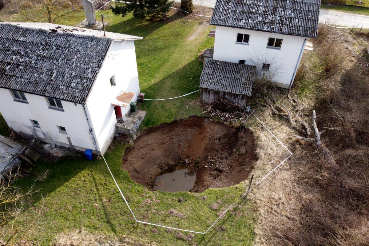 This aerial photo shows a sinkhole in the village of Mececani, central Croatia, on March 4, 2021. (Darko Bandic/AP Photo)