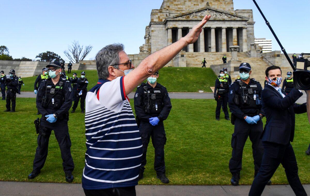 A protester performs a Nazi salute at the Shrine of Remembrance during an anti-lockdown rally in Melbourne on Sept. 5, 2020. (William West/AFP via Getty Images)
