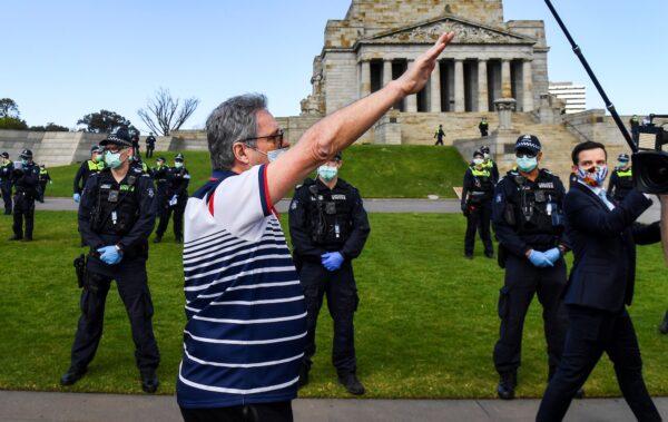 A protester performs a Nazi salute at the Shrine of Remembrance during an anti-lockdown rally in Melbourne on Sept. 5, 2020. (William West /AFP via Getty Images)