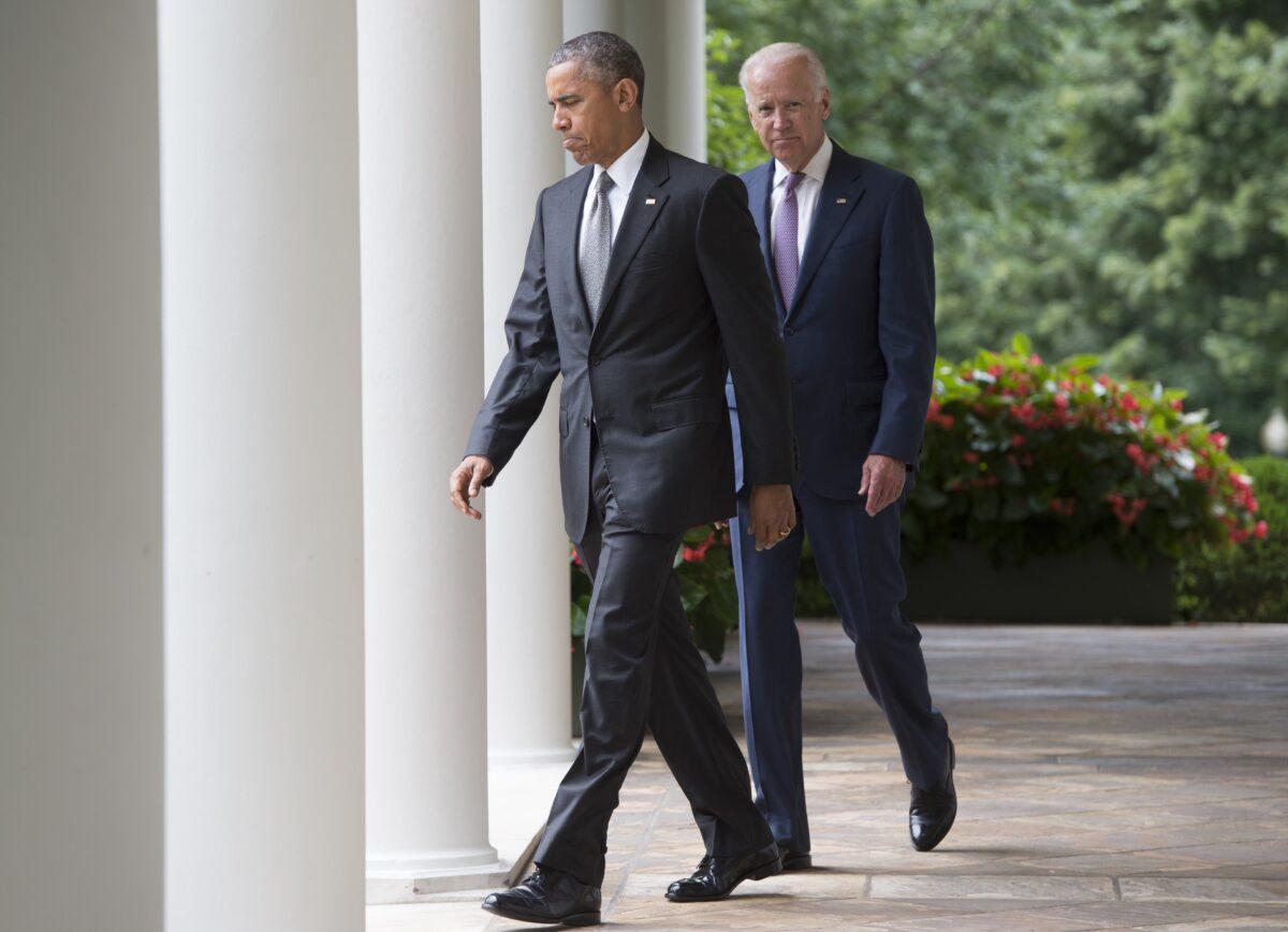  President Barack Obama walks alongside Vice President Joe Biden in the Rose Garden of the White House in Washington in a file photo. (Saul Loeb/AFP via Getty Images)