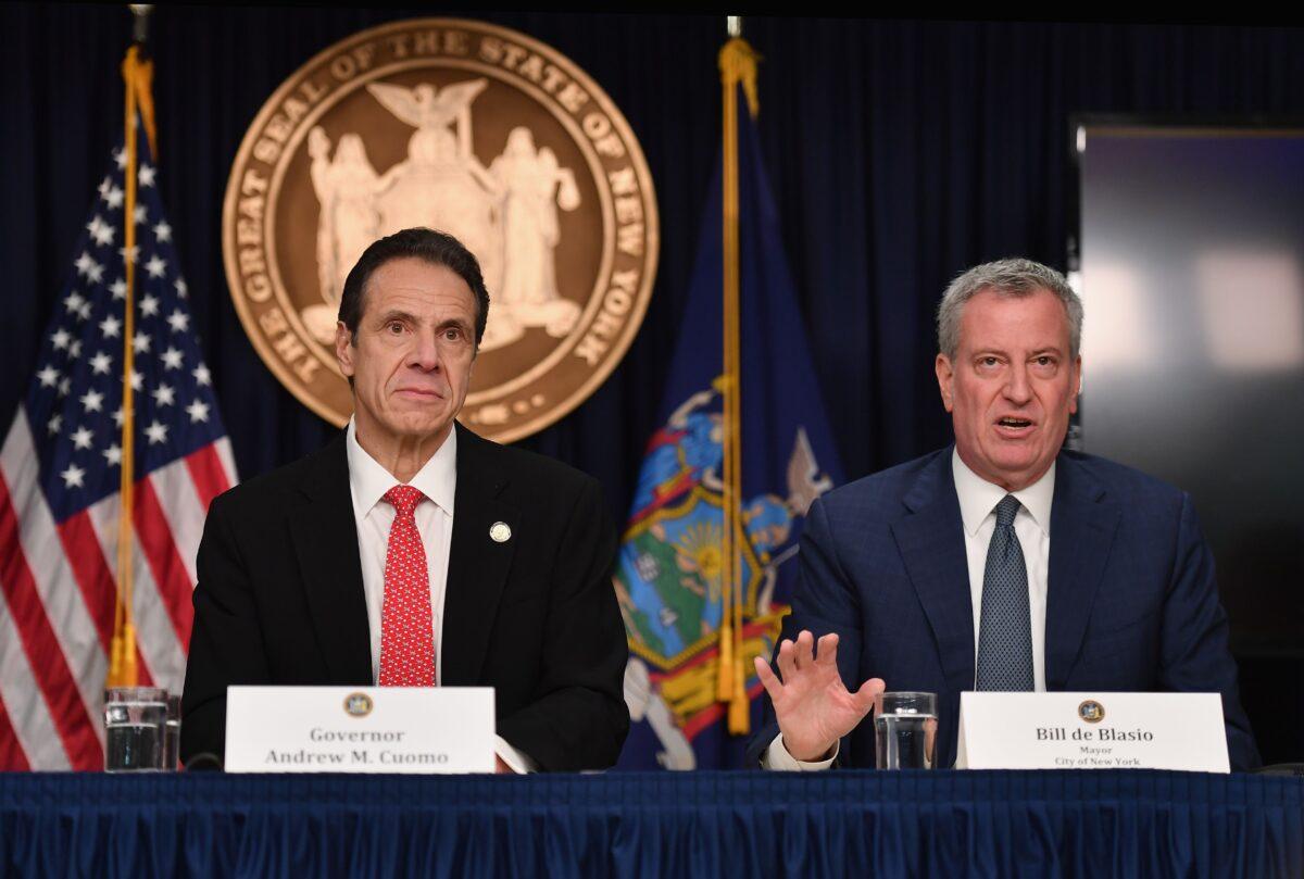 New York Gov. Andrew Cuomo (L) and New York City Mayor Bill de Blasio speak during a press conference to discuss the first positive COVID-19 case in New York State in New York City, N.Y., on March 2, 2020. (Angela Weiss/AFP via Getty Images)