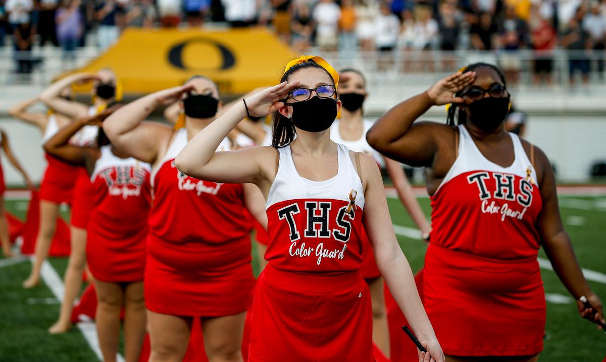 Band members wear masks as they perform before a football game between Thompson and Oxford in Alabaster, Ala., on Aug. 22, 2020. (Butch Dill/Getty Images)