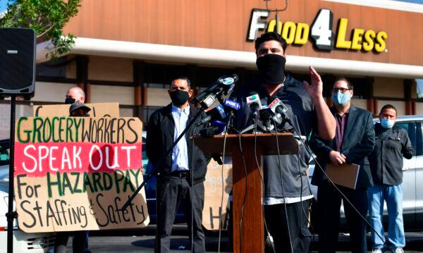  Robert Gonzales, Kroger employee for 26 years, addresses a crowd of supermarket workers gathered to protest in front of a Food 4 Less supermarket in Long Beach, Calif., on Feb. 3, 2021. (Frederic J. Brown/AFP via Getty Images)