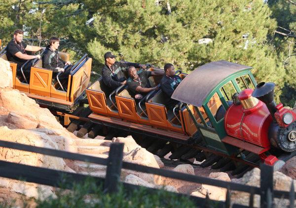 Players from the University of Oregon Ducks celebrating the 98th Rose Bowl Game ride Big thunder Mountain Railroad at Disneyland park in Anaheim, Calif. on Dec. 27, 2011. (Paul Hiffmeyer/Disney Parks via Getty Images)