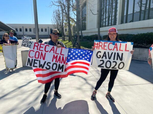 Opponents of Gov. Gavin Newsom gather at the Orange County of Registrar of Voters to help deliver recall signatures, in Orange County, Calif., on March 5, 2021. (Drew Van Voorhis/The Epoch Times)