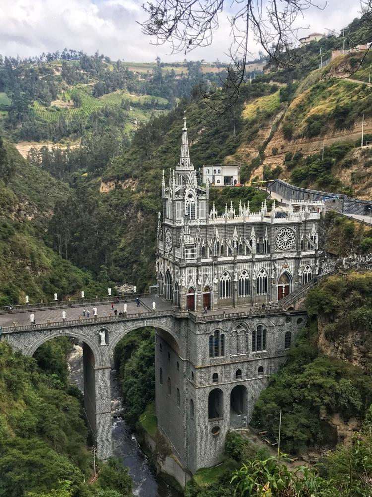 Colombia’s spectacular National Shrine Basilica of Our Lady of Las Lajas rises 330 feet from a canyon. (Omri Eliyahu/Shutterstock.com)