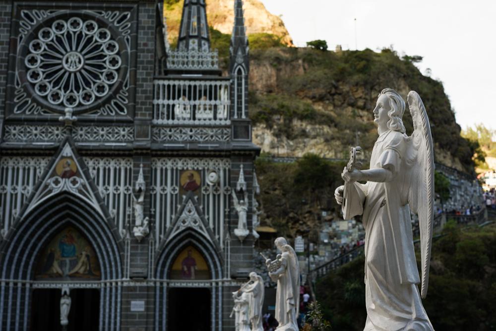 An orchestra of angels greet visitors on the bridge to Las Lajas Shrine. (ChrisVidal/Shutterstock.com)