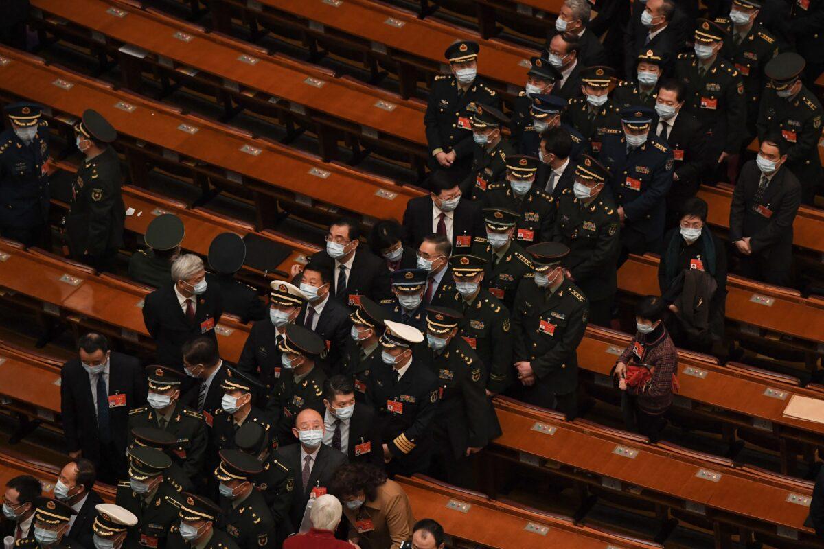 Military delegates leave after China's rubber-stamp legislature’s conference at the Great Hall of the People in Beijing, on March 8, 2021. (Noel Celis/AFP via Getty Images)