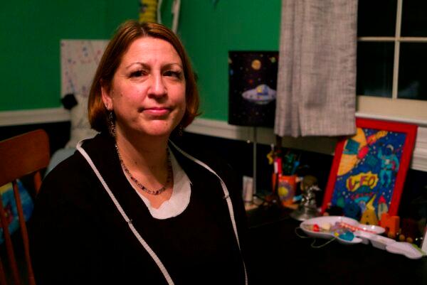 Deanna Caputo, a psychologist and mother of two, poses for a portrait in her son's bedroom at her home in Arlington, Virginia, on Feb. 4, 2021. (Bastien Inzaurralde/AFP/Getty Images )