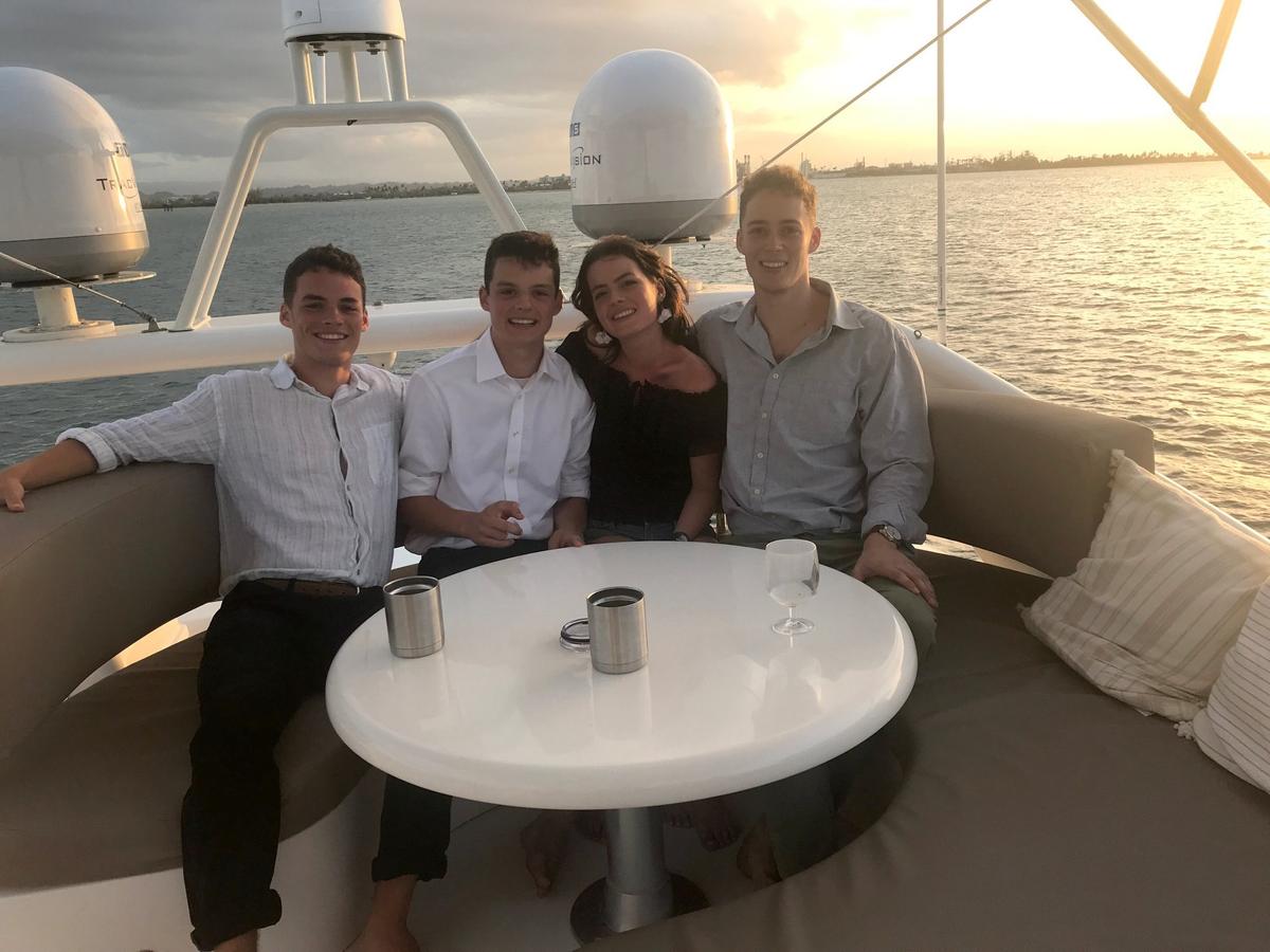 James (second from left) with his siblings on a yacht in Puerto Rico. (Courtesy of <a href="https://www.facebook.com/rosemary.laberee">Rosemary Ward Laberee</a>)