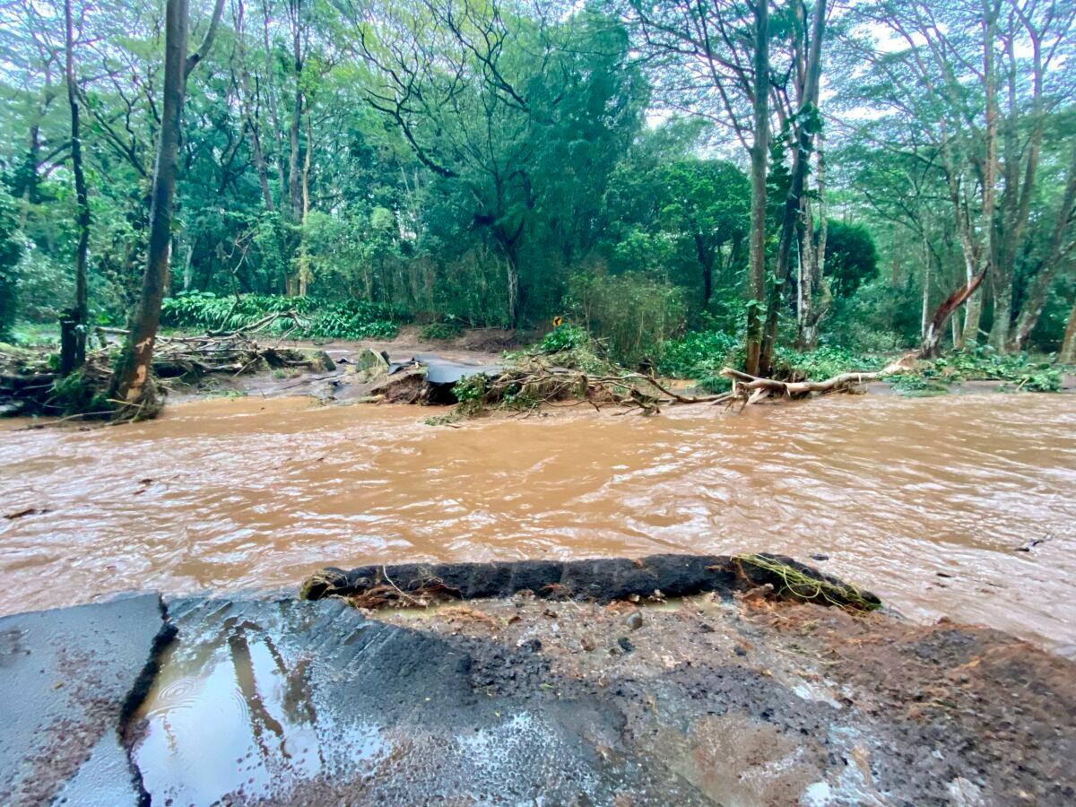 A bridge off Peahi Road is overcome by floodwaters above the Kaupakalua Reservoir and Dam after heavy rainfall in Haiku, Maui, Hawaii, on March 8, 2021. (Kehaulani Cerizo/The Maui News via AP)