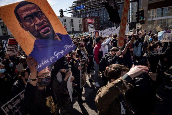  Protesters march on the first day of the Derek Chauvin trial in Minneapolis, on March 8, 2021. (Richard Tsong-Taatarii/Star Tribune via AP)