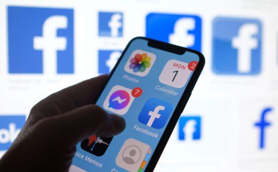 This illustration photo shows a Facebook App logo displayed on a smartphone in Los Angeles on March 1, 2021. (Chris Delmas/AFP via Getty Images)