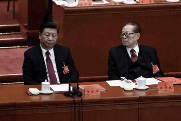 Chinese leader Xi Jinping (L) and his predecessor Jiang Zemin (R) attend the closing of the 19th Communist Party Congress at the Great Hall of the People in Beijing on Oct. 24, 2017. (Wang Zhao/AFP via Getty Images)
