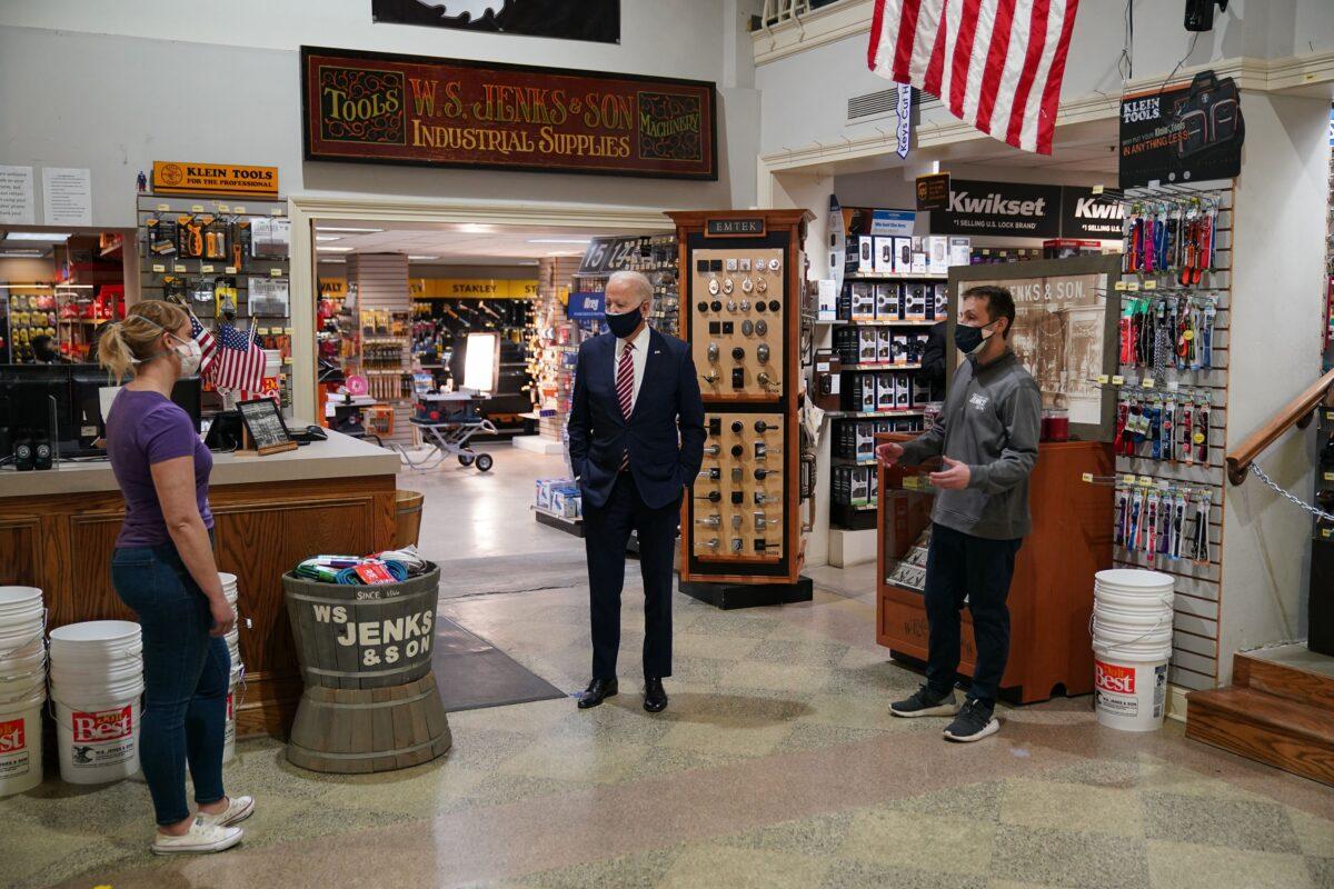 President Joe Biden, center, visits W.S. Jenks & Son, a hardware store that has benefited from Paycheck Protection Program loans, in Washington on March 9, 2021. (Mandel Ngan/AFP via Getty Images)