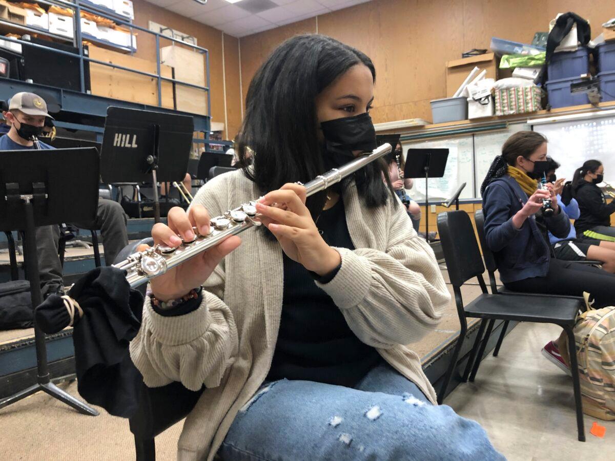 A student plays the flute while wearing a mask during a music class at the Sinaloa Middle School in Novato, Calif., on March 2, 2021. (Haven Daily/AP Photo)