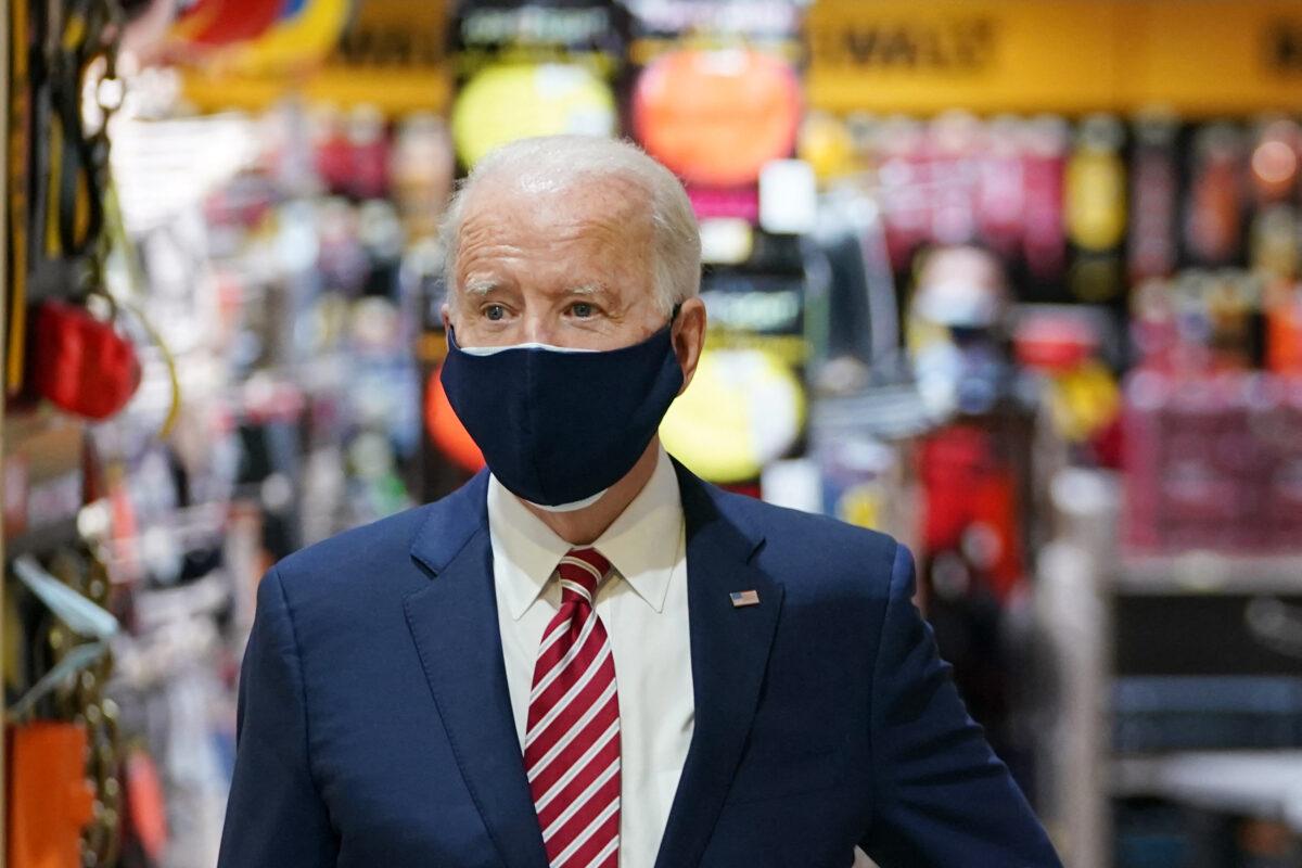 President Joe Biden visits W.S. Jenks & Son, a hardware store that has benefited from Paycheck Protection Program loans, in Washington on March 9, 2021. (Mandel Ngan/AFP via Getty Images)