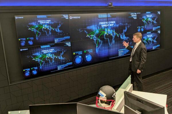 The CEO of FireEye Kevin Mandia gives a tour of the cybersecurity company's unused office space in Reston, Va., on March 9, 2021. (Nathan Ellgren/AP Photo)