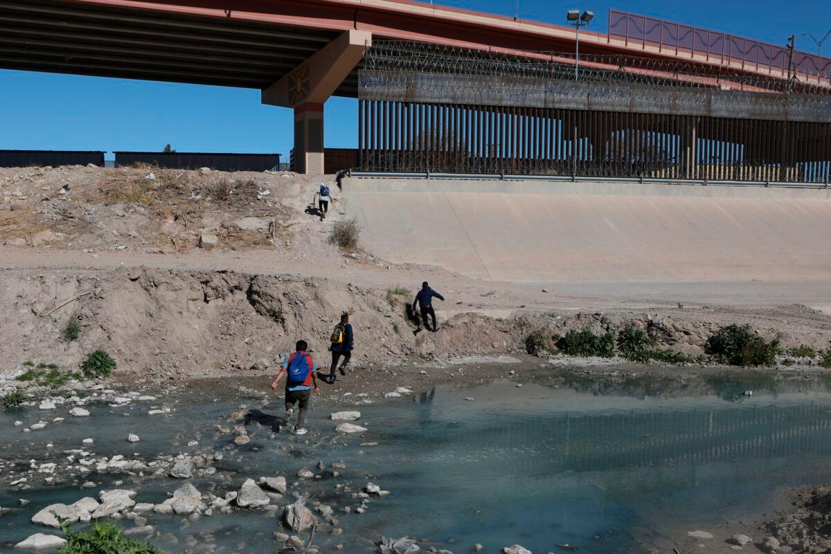 Illegal aliens cross the Rio Bravo to get to El Paso, Texas, from Ciudad Juarez, Chihuahua state, Mexico, on Feb. 5, 2021. (Herika Martinez/AFP via Getty Images)