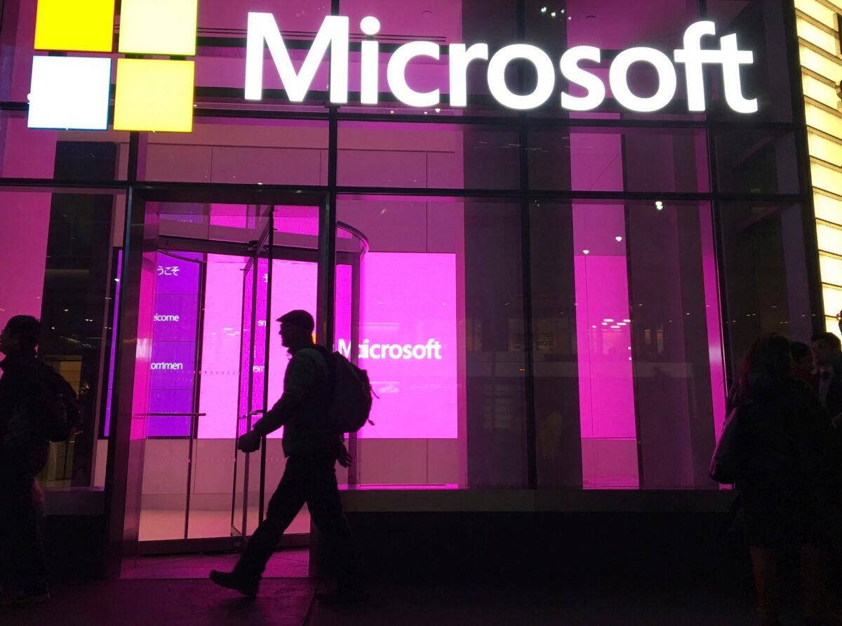  People walk past a Microsoft office in New York on Nov. 10, 2016. (Swayne B. Hall/AP Photo File)