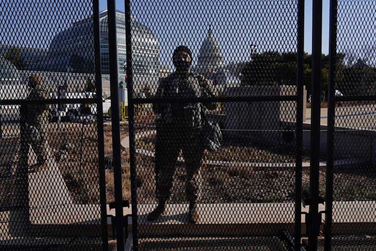 National Guard troops stand guard at a perimeter fence at the Capitol in Washington on March 4, 2021. (Carolyn Kaster/AP Photo)