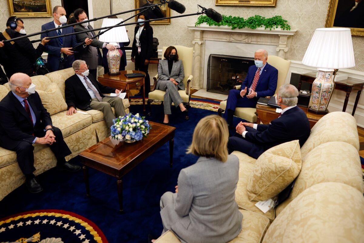 President Joe Biden and Vice President Kamala Harris attend a meeting with bipartisan senators on infrastructure investment at the Oval Office of the White House in Washington on Feb. 11, 2021. (Carlos Barria/Reuters)