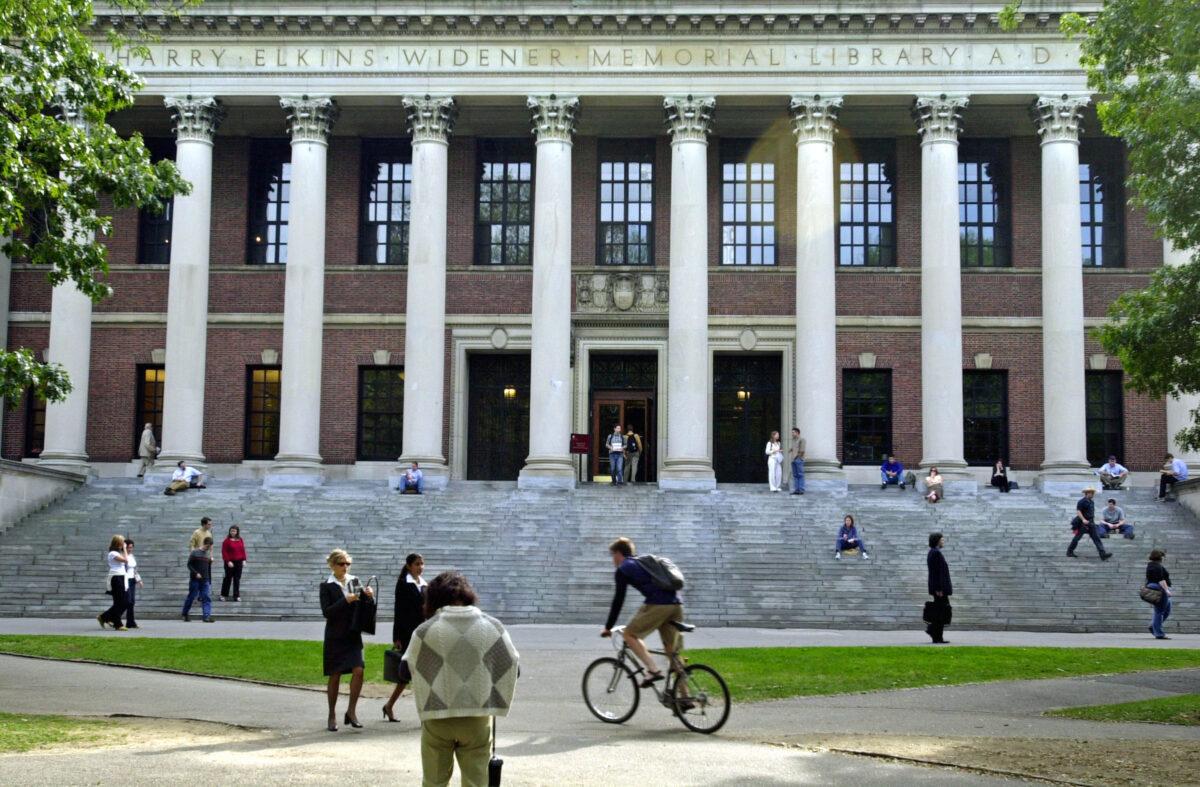 Students pass in front of Harvard's Widener Library in Cambridge, Mass., on Oct. 10, 2003. (William B. Plowman/Getty Images)