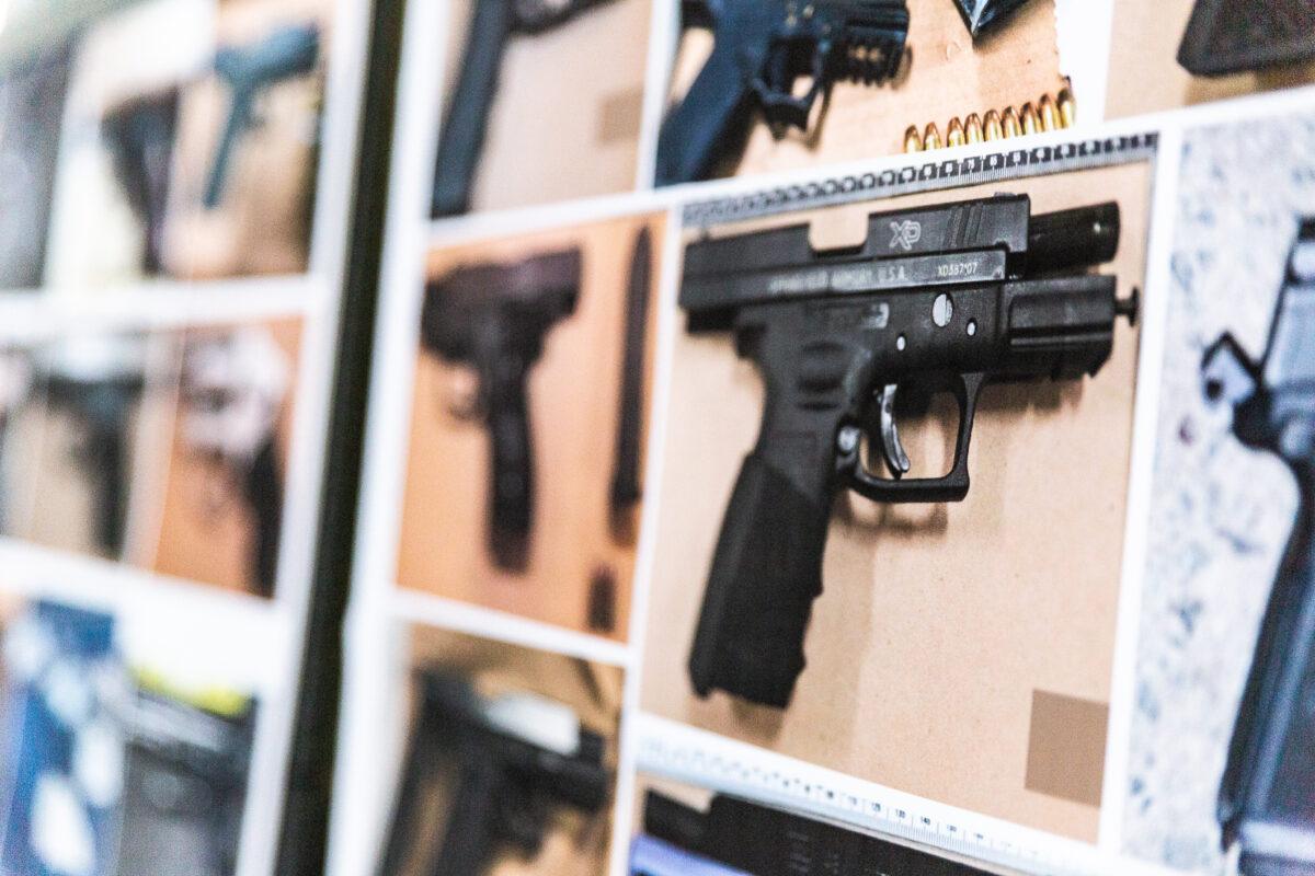 Guns confiscated by the Santa Ana Police Department are displayed for a press event in Santa Ana, Calif., on March 11, 2021. (John Fredricks/The Epoch Times)