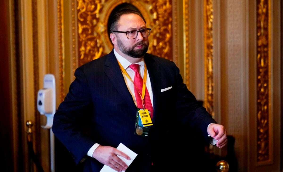 Jason Miller, senior adviser to the Trump 2020 reelection campaign, walks in the U.S. Capitol during the second impeachment trial of former President Donald Trump, in Washington on Feb. 9, 2021. (Andrew Harnik/POOL/AFP via Getty Images)