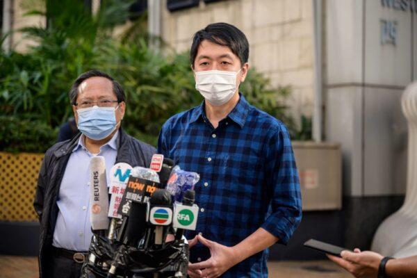 A former lawmaker from Hong Kong's pro-democracy opposition Ted Hui (R), accompanied by veteran pro-democracy politician Albert Ho (L), speaks to the media as he leaves the Western Police Station in Hong Kong on November 18, 2020. (Anthony Wallace/AFP via Getty Images)