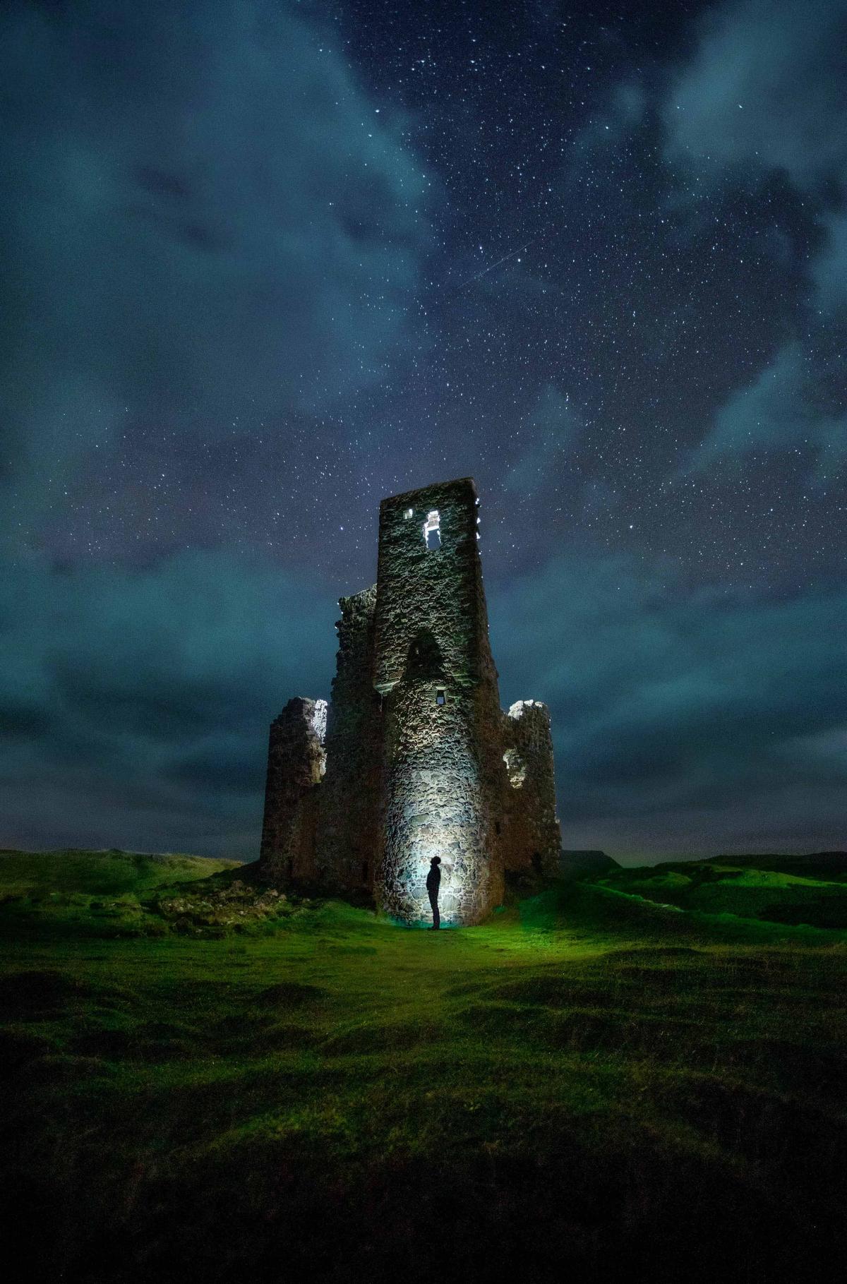 A self-portrait of Paul Zizka at Ardvreck Castle in Scotland (Caters News)