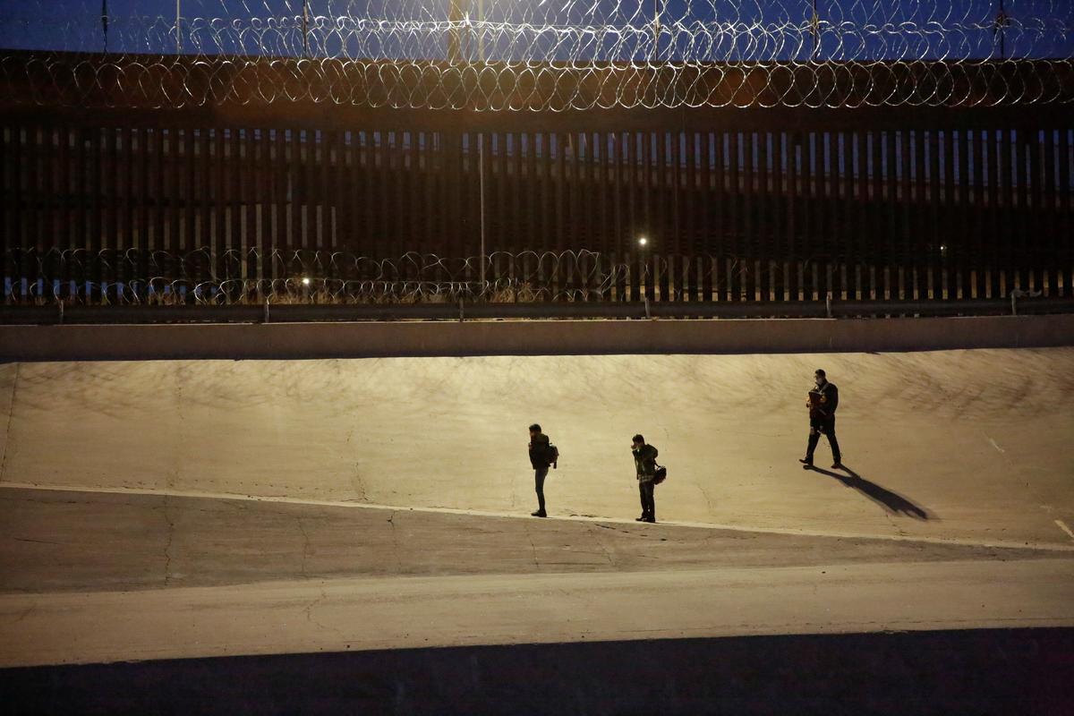 Illegal immigrants are seen after crossing the Rio Bravo river to turn themselves in to U.S. Border Patrol agents to request asylum in El Paso, Texas, as seen from Ciudad Juarez, Mexico, on March 4, 2021. (Jose Luis Gonzalez/Reuters)