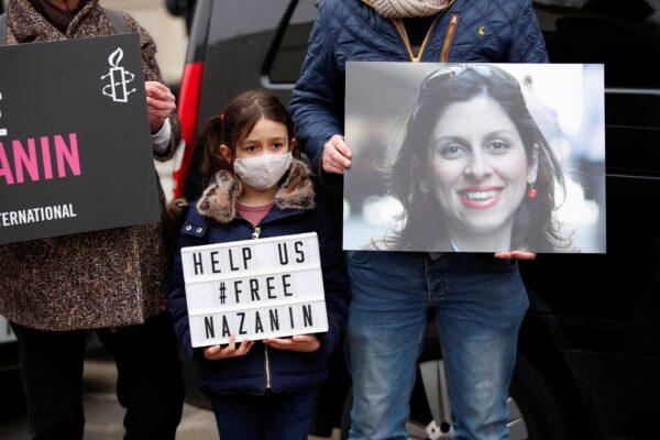 Gabriella Ratcliffe, daughter of British-Iranian aid worker Nazanin Zaghari-Ratcliffe, protests outside the Iranian Embassy in London on March 8, 2021. (Andrew Boyers/Reuters)