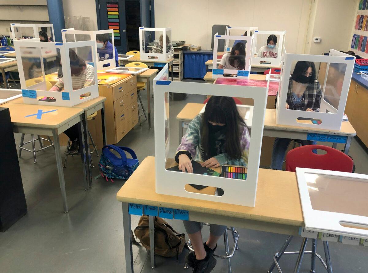 Socially distanced and with protective partitions, students work on an art project during class at the Sinaloa Middle School in Novato, Calif., on March 2, 2021. (Haven Daley/AP)