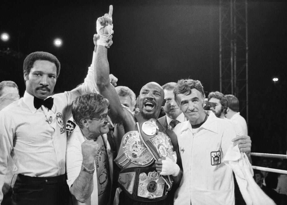 Middleweight champion Marvin Hagler celebrates his title with his manager, Pat Petronelli, and co-manager, Goody Petronelli, in Las Vegas, on April 1985. (AP Photo)