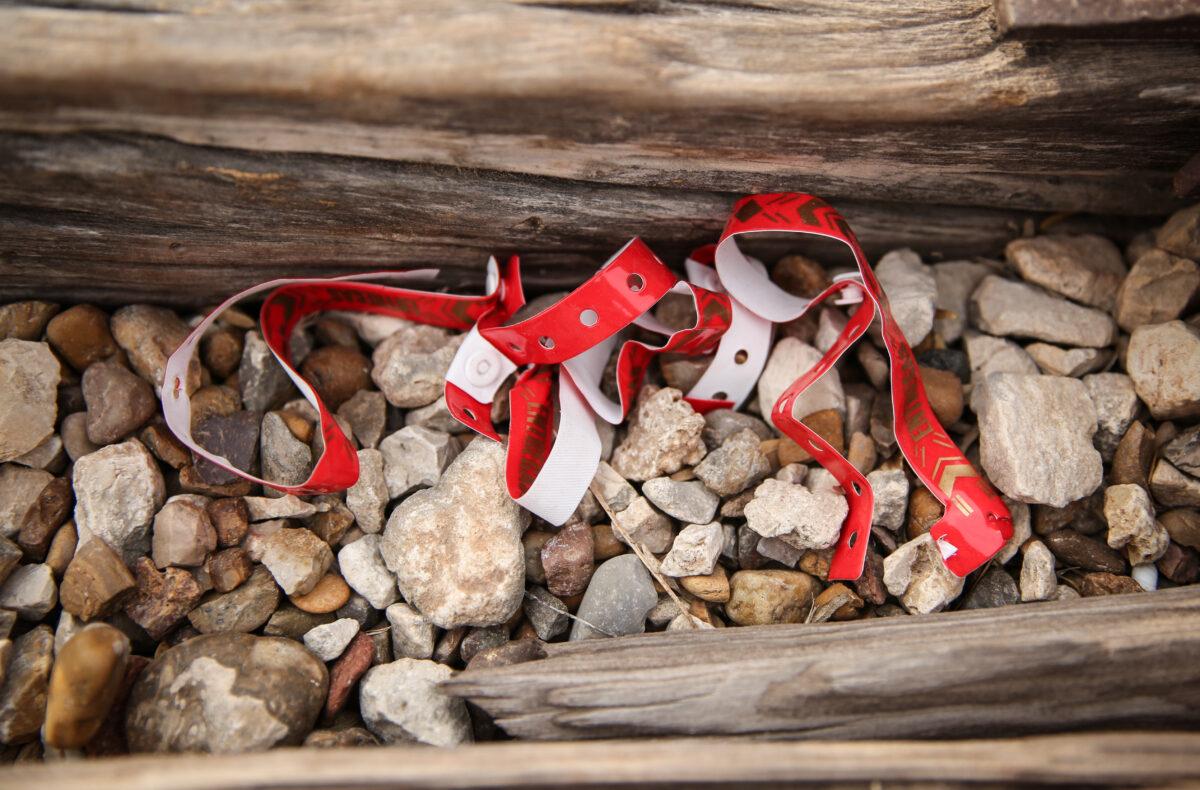 Wristbands used by smuggling organizations and cartels are found discarded near the border after illegal immigrants remove them, in Penitas, Texas, on March 14. 2021. (Charlotte Cuthbertson/The Epoch Times)