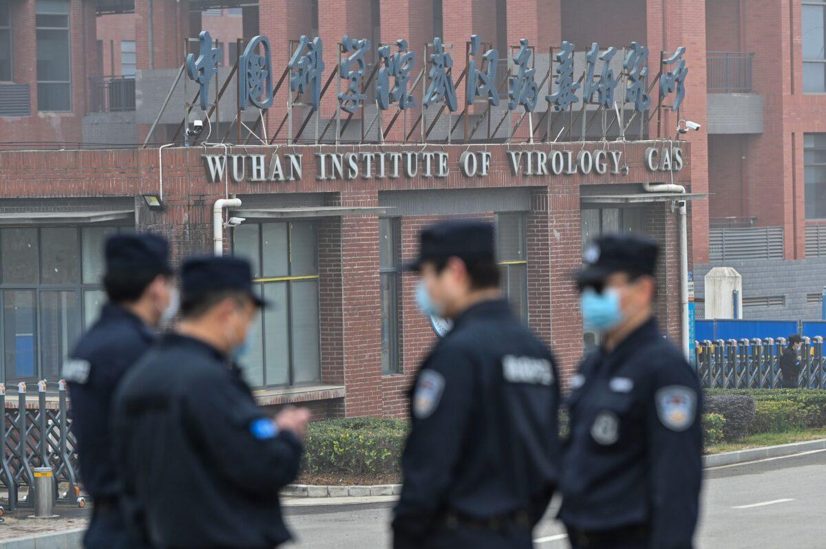 Security personnel stand guard outside the Wuhan Institute of Virology in Wuhan, China, on Feb. 3, 2021. (Hector Retamal /AFP via Getty Images)