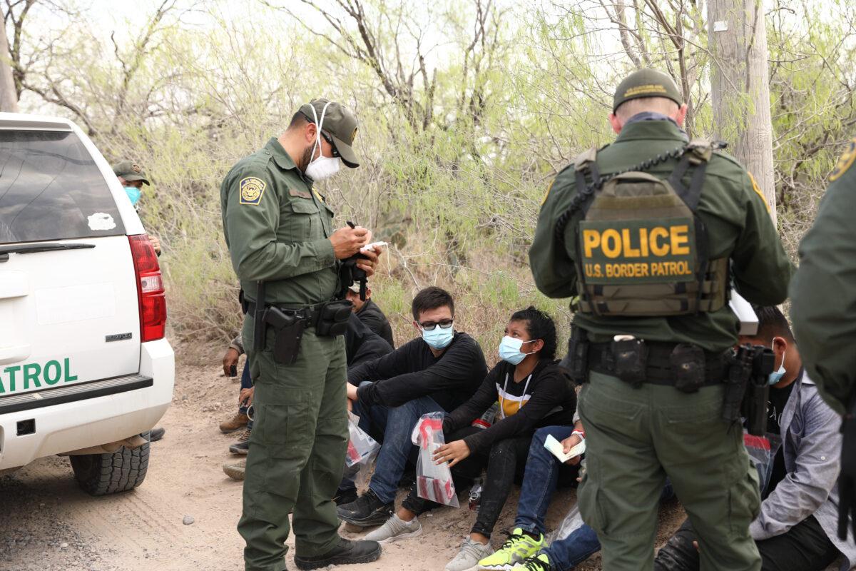 Border Patrol agents arrest seven illegal immigrants who tried to evade capture near Penitas, Texas, on March 15. 2021. (Charlotte Cuthbertson/The Epoch Times)