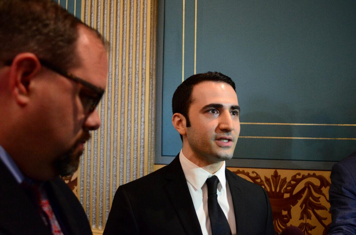 Amir Hekmati (R) speaks with the media in the Michigan Senate Chamber in Lansing, Mich., on May 26, 2016. (Michael Gerstein/AP Photo)