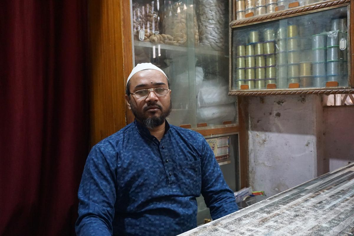 Ansar Alam, a silk merchant, sits in his shop in the Madan Pura locality of Varanasi, India, on Feb. 18, 2021. (Venus Upadhayaya/Epoch Times)