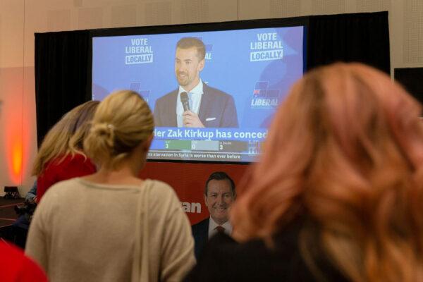 Labor supporters watch the screen as Liberal leader Zak Kirkup gives a speech at the Gary Holland Community Centre in Rockingham, Australia, on Mar. 13, 2021. (Will Russell/Getty Images)