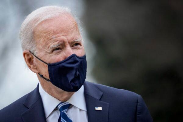 President Joe Biden stops briefly to talk to the press as he walks toward Marine One on the South Lawn of the White House in Washington, D.C., on March 16, 2021. (Drew Angerer/Getty Images)