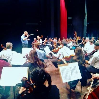 Conductor Rodrigo Müller rehearsing the author’s Billboard No. 1 composition “The Sea Knows” with the strings of the<br/>Orquestra Sinfônica de Limeira, São Paulo, Brazil. (Courtesy of Michael Kurek)