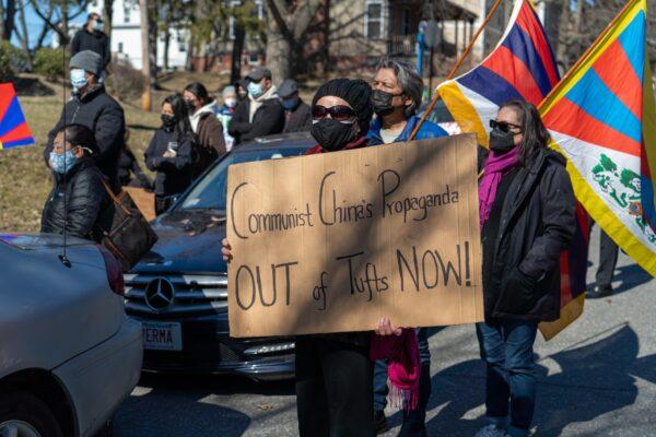 A protester asks Tufts University to close its Confucius Institute, a language training program that the Chinese regime uses to promote Communist mentalities, in Somerville, Massachusetts on March 13, 2021. (Learner Liu/The Epoch Times)