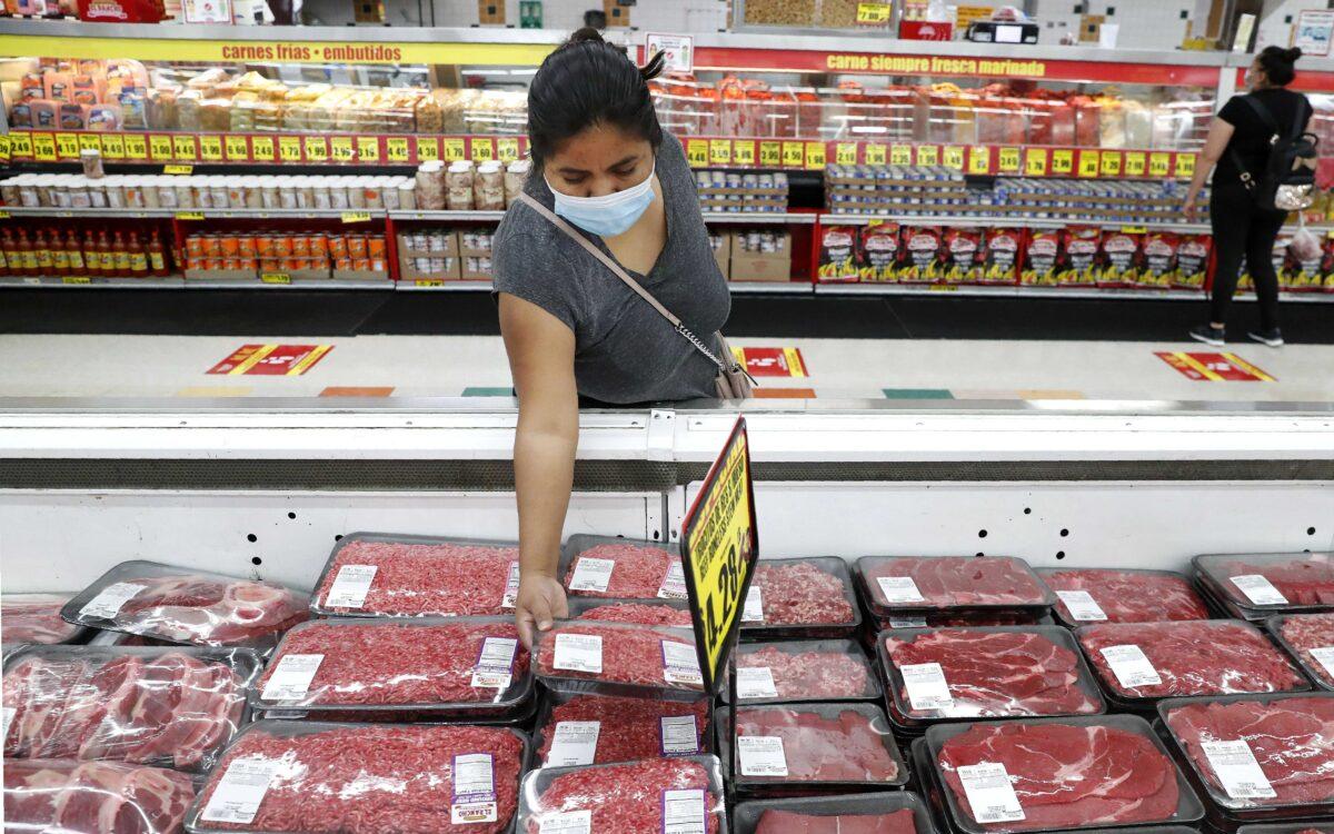 A shopper looks over meat products at a grocery store in Dallas, Texas, on April 29, 2020. (LM Otero/AP Photo)