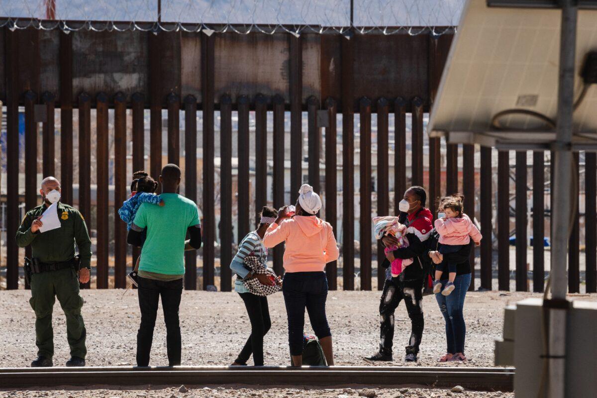Border Patrol agents apprehend a group of illegal immigrants near downtown El Paso, Texas, on March 15, 2021. (Justin Hamel/AFP via Getty Images)
