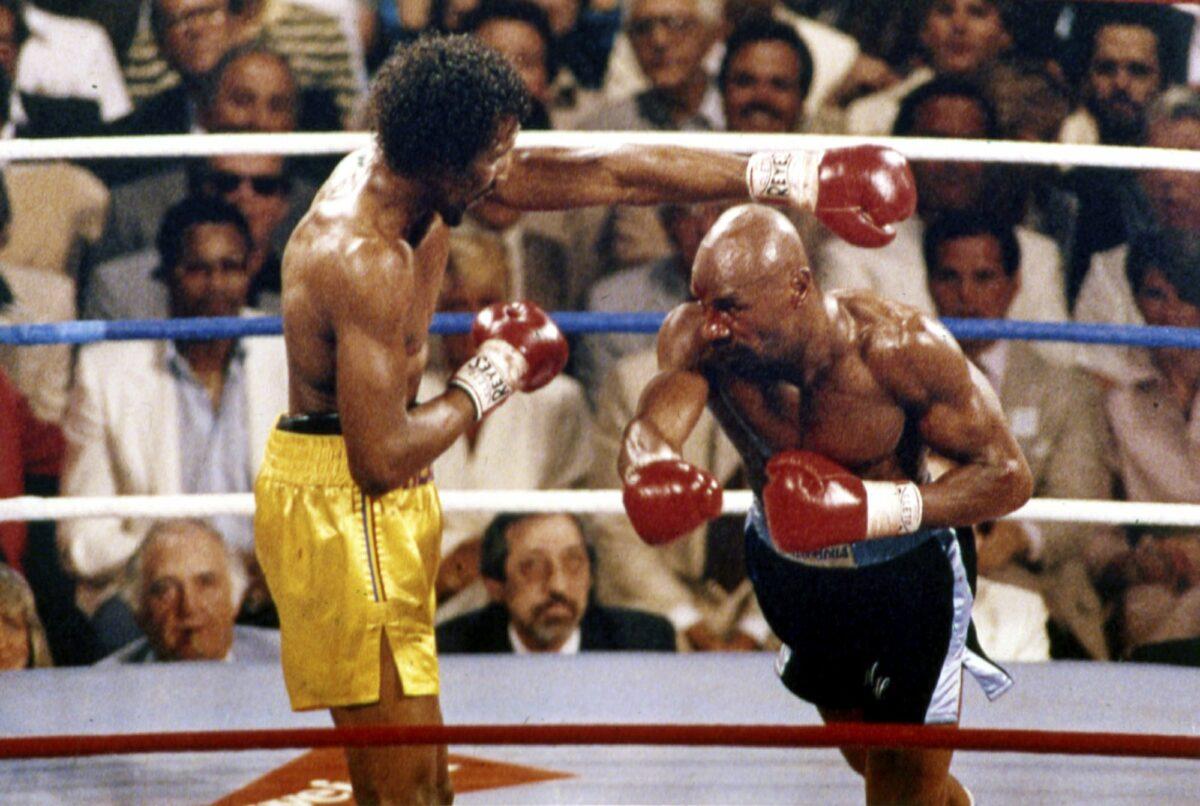 In this April 1985 file photo, Marvin Hagler, right, and Thomas Hearns fight during the first round of a world championship boxing bout in Las Vegas. (AP Photo, File)