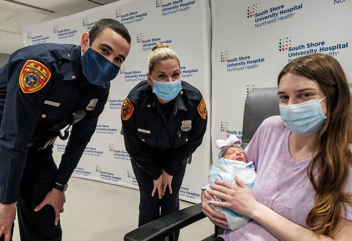 Nicole (R) with her baby, Officer Daniel Rosado (L) and Officer Danielle Congedo (C). (Courtesy of <a href="https://www.northwell.edu/">Northwell Health</a>)
