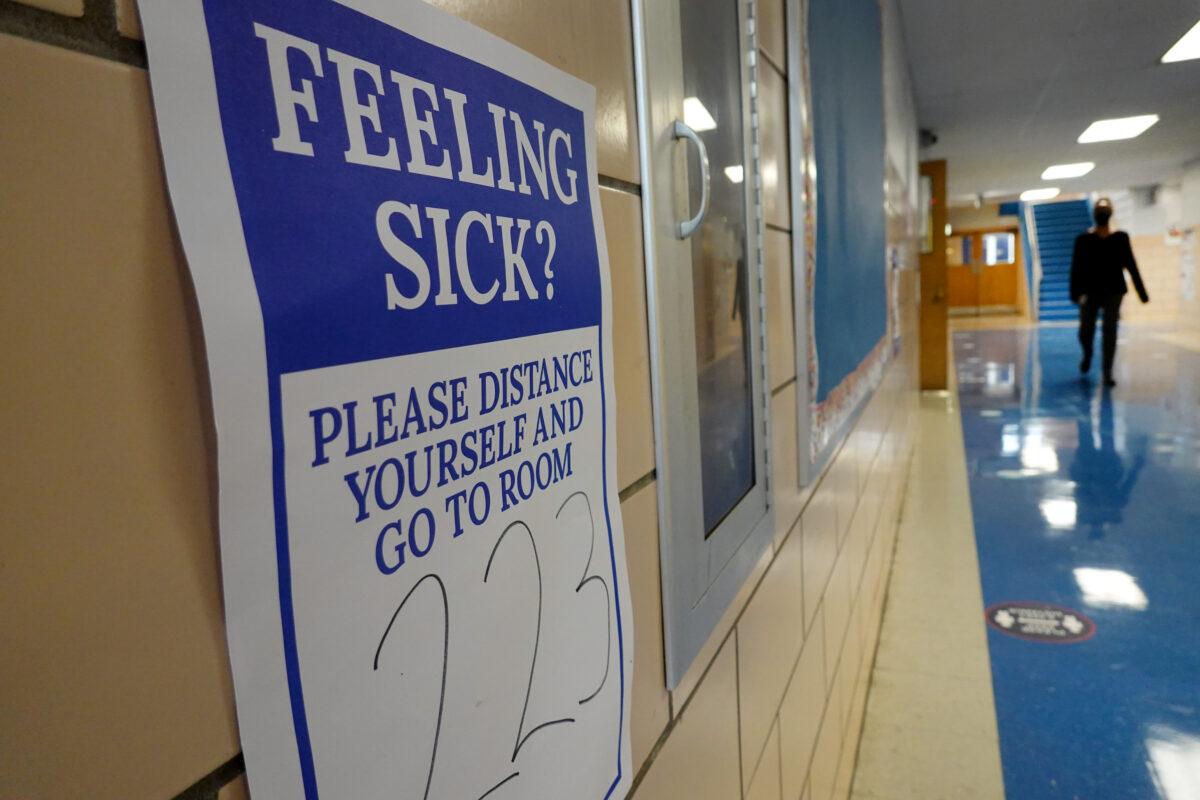 A sign is seen in a hallway at King Elementary School as schools in Chicago started remote classes because of COVID-19 worries, in Chicago, Ill., on Sept. 8, 2020. (Scott Olson/Getty Images)